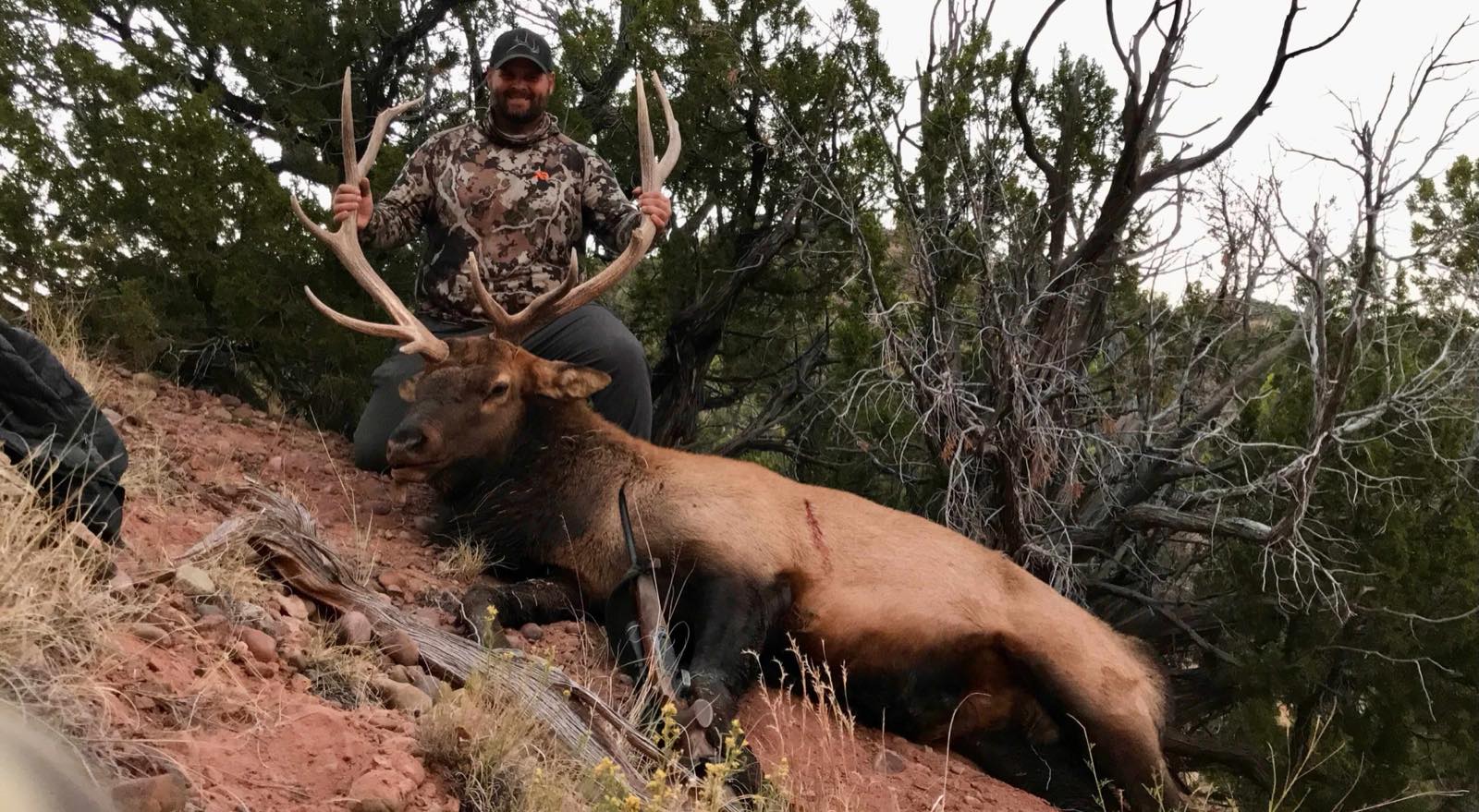 Jon Olson, founder of Elk Finder, with a bull elk he harvested on public land in New Mexico